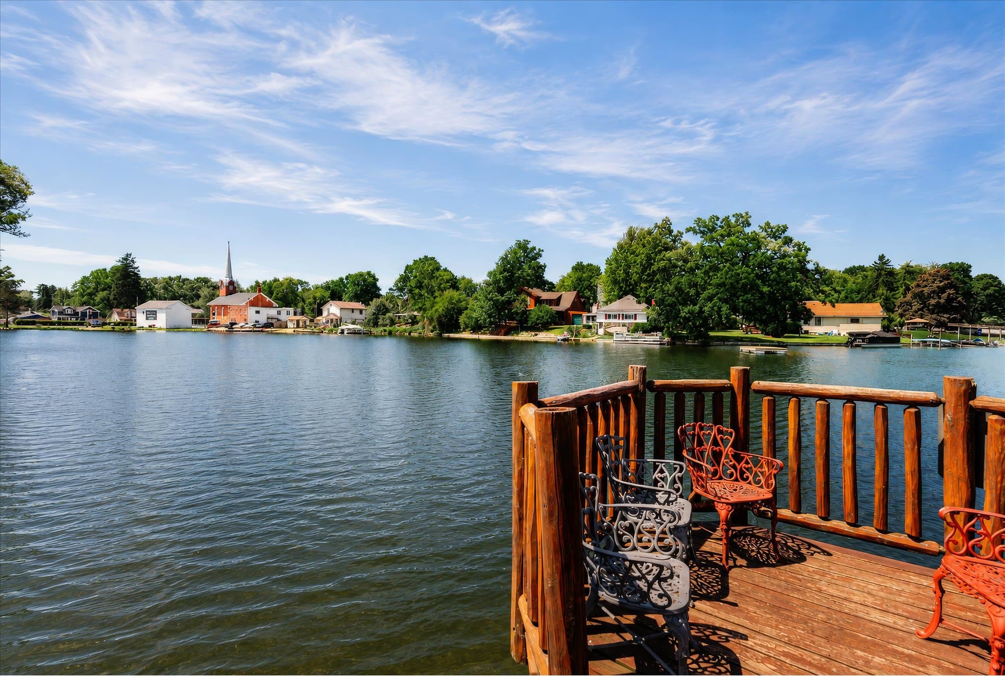 Lakefront setting and covered deck at Olde Mill Inn of Clarkston