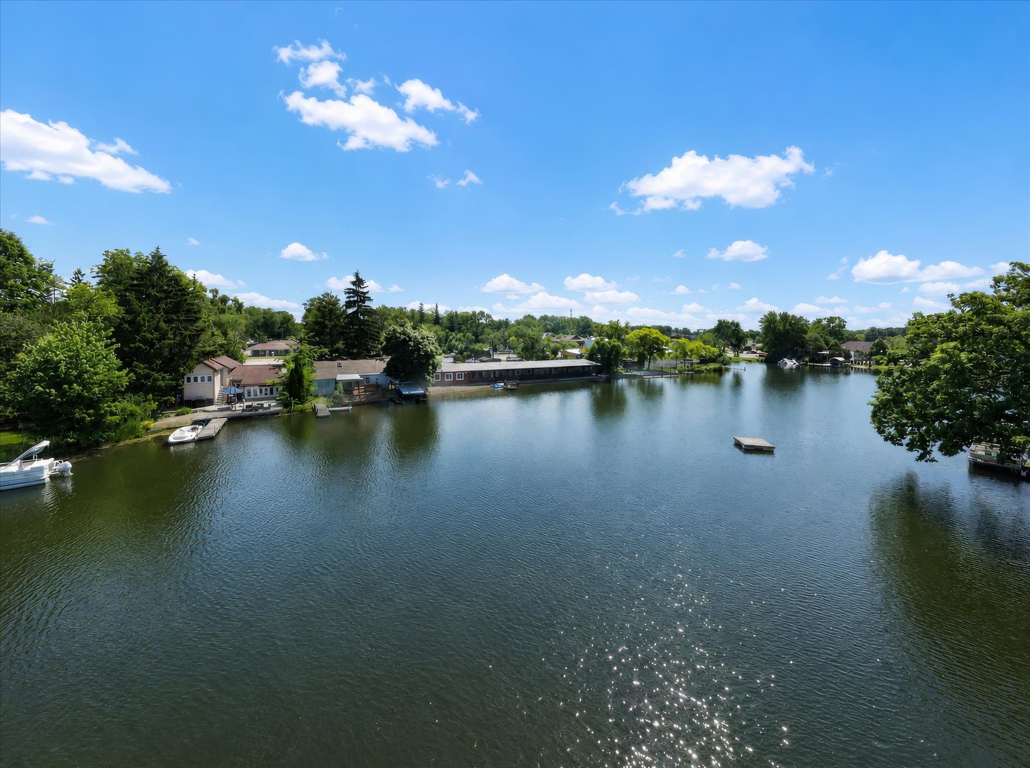 Aerial view of Olde Mill Inn of Clarkston along the shoreline of Van Norman Lake